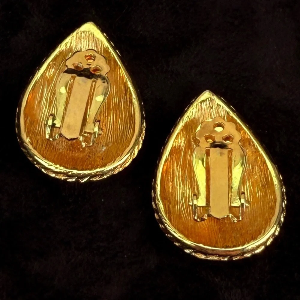Vintage goldtone, black and cream enamel clip on earrings